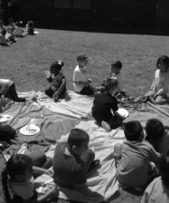 group of children having picnic outside the classroom