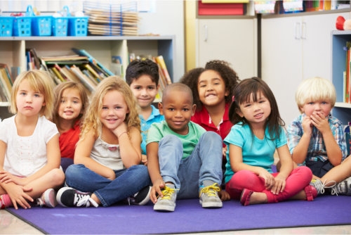multi-ethnic group of kids in a childcare facility